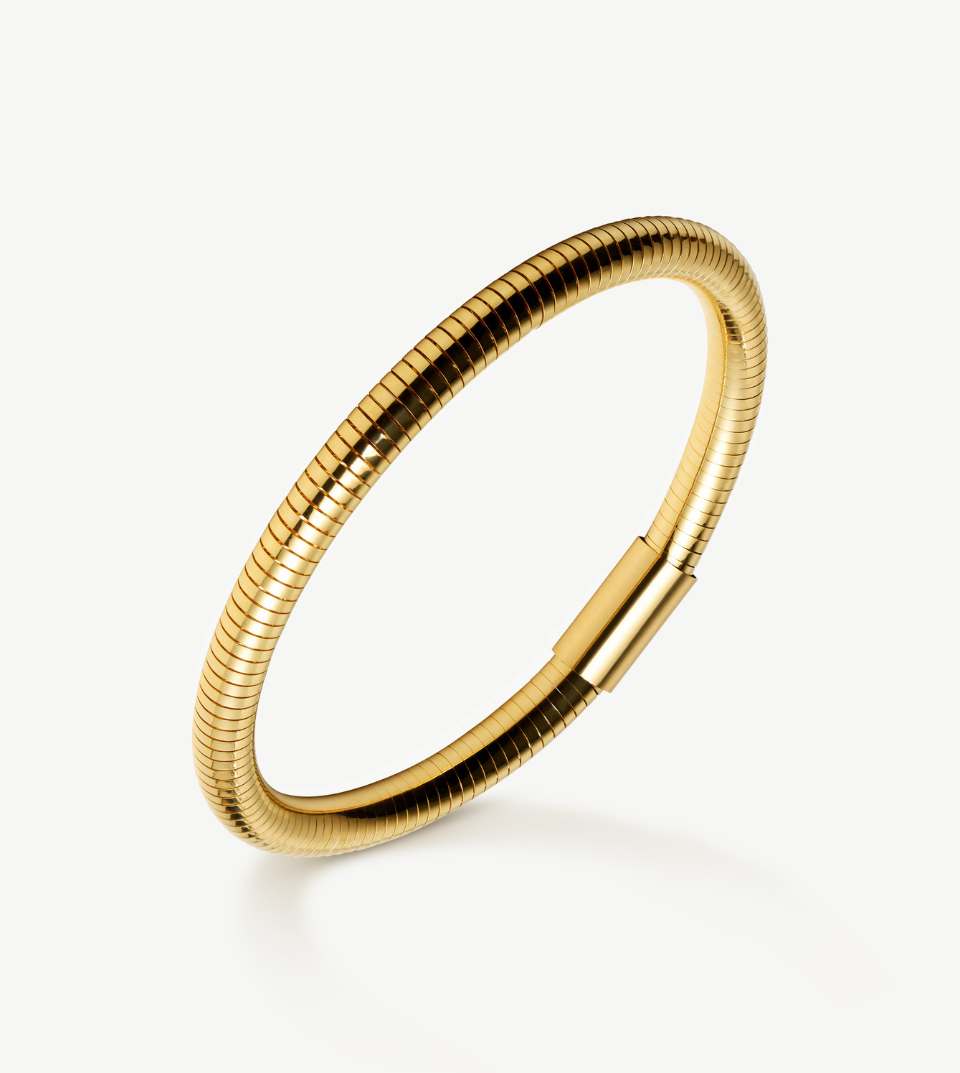 Gold bracelet on a white background