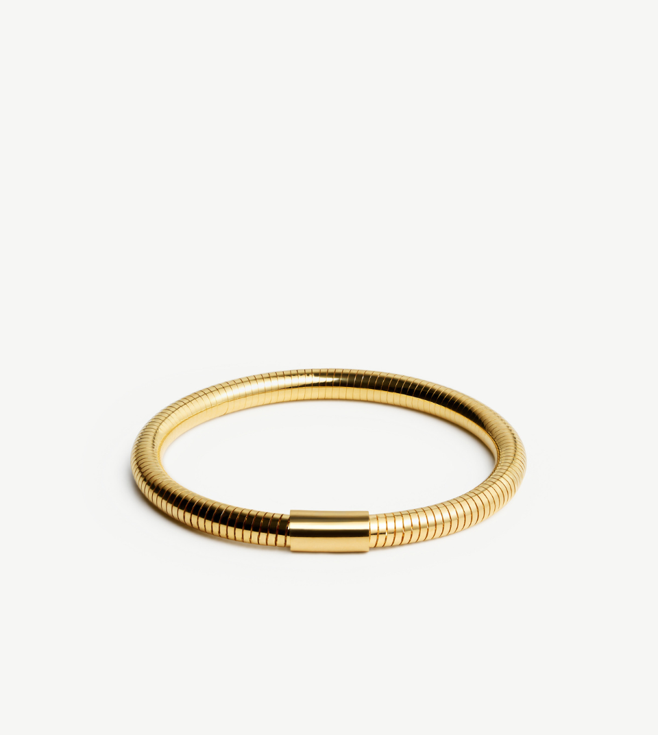 Gold bracelet on a white background